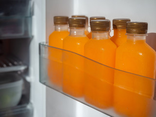 Orange juice iced cold in the bottles.