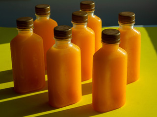 Orange juice iced cold in the bottles.