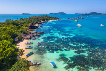 Aerial view of people swimming on the sea and beach on Gam Ghi Phu Quoc island in Thailand bay,...