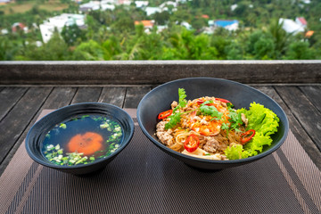 Hu Tieu Nam Vang or Hu Tiu Nam Vang Vietnamese food, Phnom-penh clear rice noodle soup, famous food originated from Cambodia at Phu Quoc island, Vietnam. High view to Duong Dong town