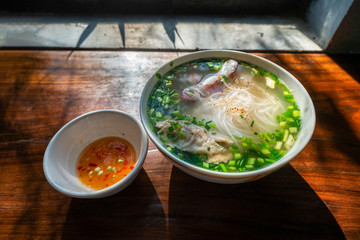 Bun Quay Vietnamese food or Quay rice noodle on wood background, famous food at Phu Quoc island, Kien Giang, Vietnam.