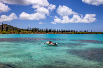 Fishing boat anchored by the coast of Isle of Pines, New Caledonia