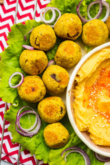 Baked chickpea falafel to eat with hummus, salad leaves and pita bread. Vegan healthy food.