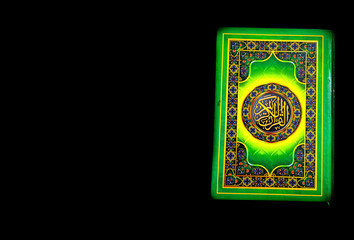 A photo of the Quran ready for Ramadan.  Arabic on the cover is translated as the Qur'an