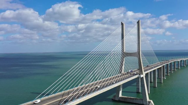 Vasco da Gama Bridge in Lisbon is a famous landmark in the city - aerial drone footage
