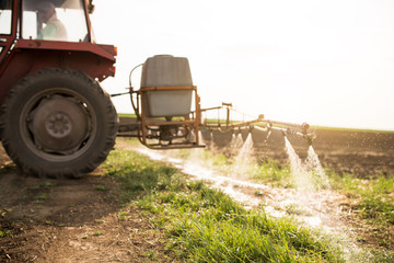 Agricultural sprayers, spray chemicals on field. spraying pesticides on field with sprayer