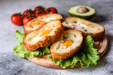 Delicious breakfast with grunts, eggs, avocado and cherry tomatoes