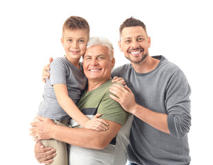 Man with his father and son on white background