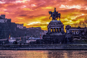Colorful Sunrise burning sky Koblenz City historic monument German Corner where river rhine and...