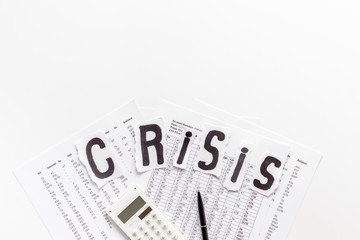 Financail crisis - calculator, documents - on white table from above space for text