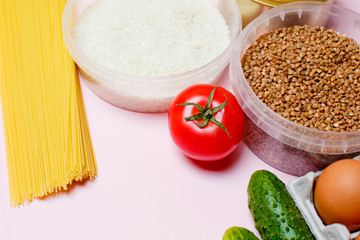 Food donations on a pink background, space for text