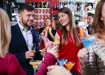 Girl flirting with man on party in bar