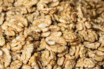 Background made of nuts. Peeled walnuts in the market. Healthy, wholesome food. Organic products. Source of vitamins and minerals. Grocery market in Georgia.