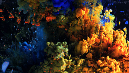 Macro photo shoot of colorful Ink in water. Power magic multi color Underwater Paint Drops...