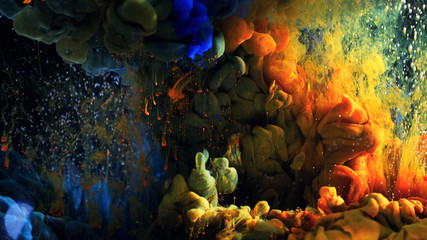 Macro photo shoot of colorful Ink in water. Power magic multi color Underwater Paint Drops...