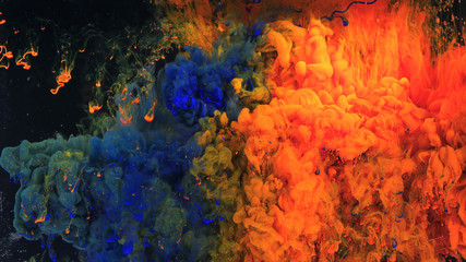 Fototapeta na wymiar Macro photo shoot of colorful Ink in water. Power magic multi color Underwater Paint Drops background. Red camera still poster backdrop. Beautiful wallpaper.