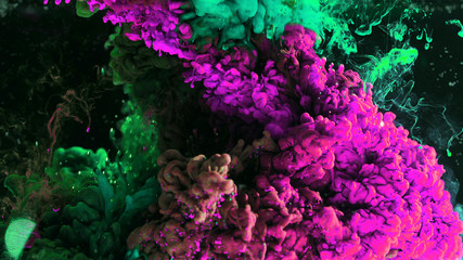 Macro photo shoot of colorful Ink in water. Power magic multi color Underwater Paint Drops...