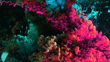 Macro photo shoot of colorful Ink in water. Power magic multi color Underwater Paint Drops...