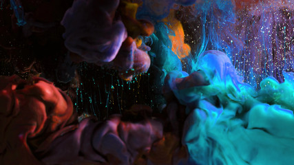 Macro photo shoot of colorful Ink in water. Power magic multi color Underwater Paint Drops...