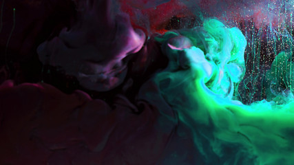 Macro photo shoot of colorful Ink in water. Power magic multi color Underwater Paint Drops...