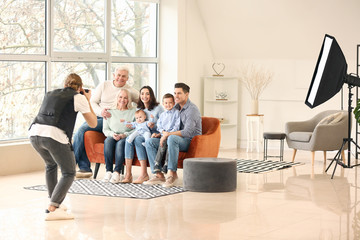 Fototapeta premium Photographer working with family in studio