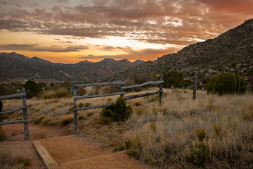 Sunset in the Sandia Mountains high desert landscape on the Three Guns Spring trail in Carnuel, New Mexico outside of Albuquerque