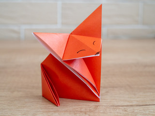 Orange fox via origami technique. DIY concept. Children's creativity.