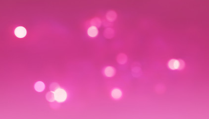 blurred pink abstract background with bokeh lights