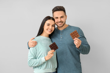 Fototapeta premium Couple enjoying chocolate, sweet treats and indulgence, happy relationship and sharing moments
