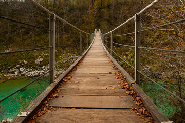Fototapeta premium bridge over the green mountain water