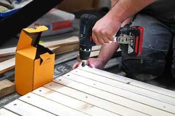 Man using wood work tools.