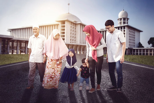 Muslim family walking together outside the mosque
