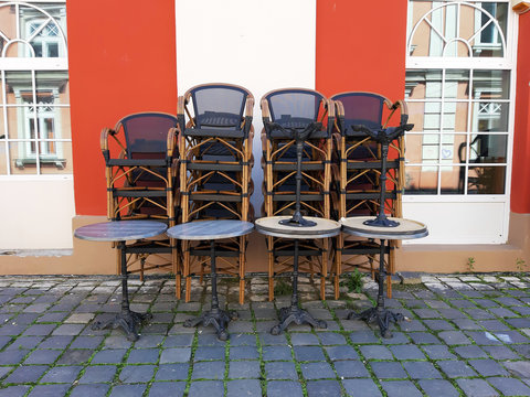 Stacked Chairs Of A Closed Outdoor Restaurant.