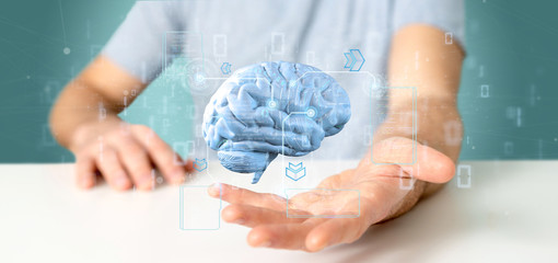 Businessman holding a Intelligence artificial brain with data - 3d rendering