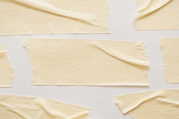 Yellow adhesive paper tape on white background