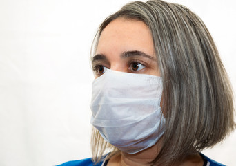 A young girl in a medical mask . Protection against dust, virus and bacteria.