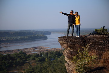 Women and men enjoy the view at Pha Taem National Park, Ubon Ratchathani, Thailand