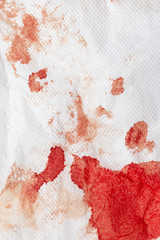 blood stains on a white napkin