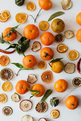 Dried oranges and clementines on a marble countertop
