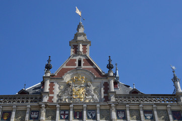 Fototapeta premium facade of the central station of Amsterdam with a golden crown and two lions