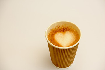 Freshly brewed coffee with heart-shaped milk forth