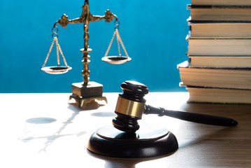 Concept of justice. Law scales on blue background.