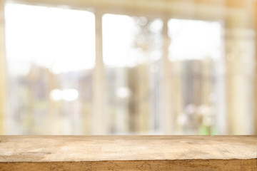 Top of wooden table on window glass blur. Of green from the garden of the vegetable garden on a morning background. To display product montage.
