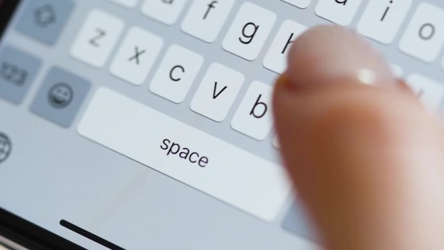 Hands typing text on smartphone close-up