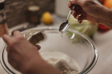 Process of adding yeast to a dough mixture