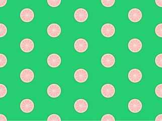Slices of fresh grapefruit seamless pattern. Suitable for textile, wrapping, wallpaper