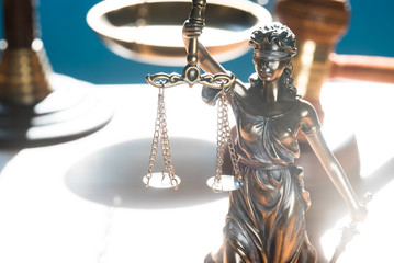 Concept of justice. Law scales on blue background.