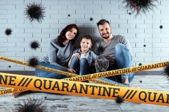 Quarantine Barrier yellow forbidden tape, isolation. Coronavirus. The family sits at home and particles of the virus COVID-19. The concept of a ban on leaving the house, self-isolation. - Powered by Adobe