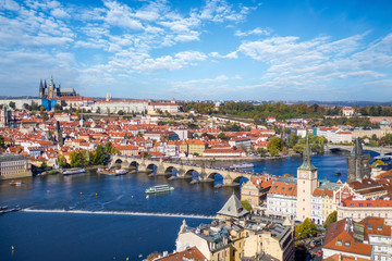 Beautiful aerial view to the famous Charles Bridge and Castle on top of the Mala Strana district in Prague, Czech Republic, during a sunny day
