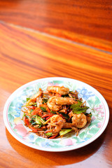 The hot fried stir spicy giant shrimp serve on dish.
